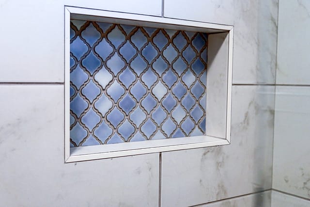 Master bath shower niche with arabesque tile pattern.