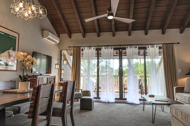 Living room looking out to lanai from large sliding glass door.