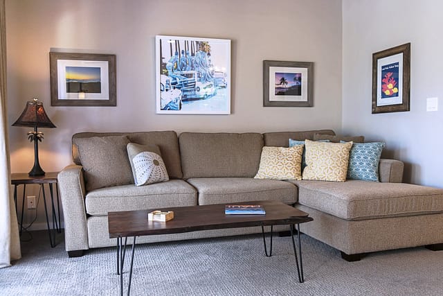 L-shaped sleeper sofa with wood coffee table.